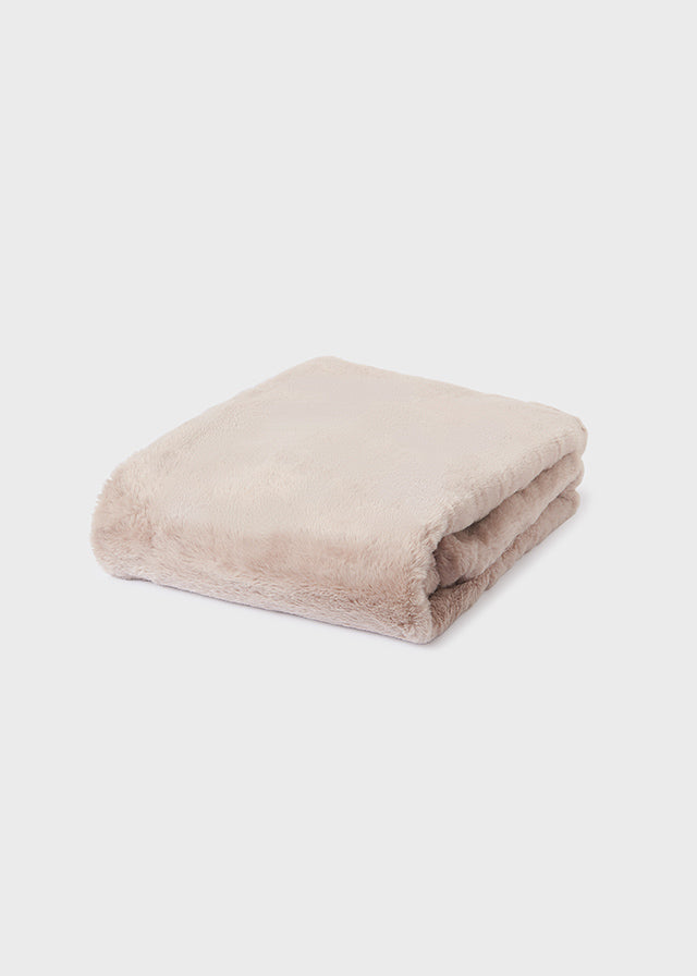 Coperta in pelliccia con pon pon