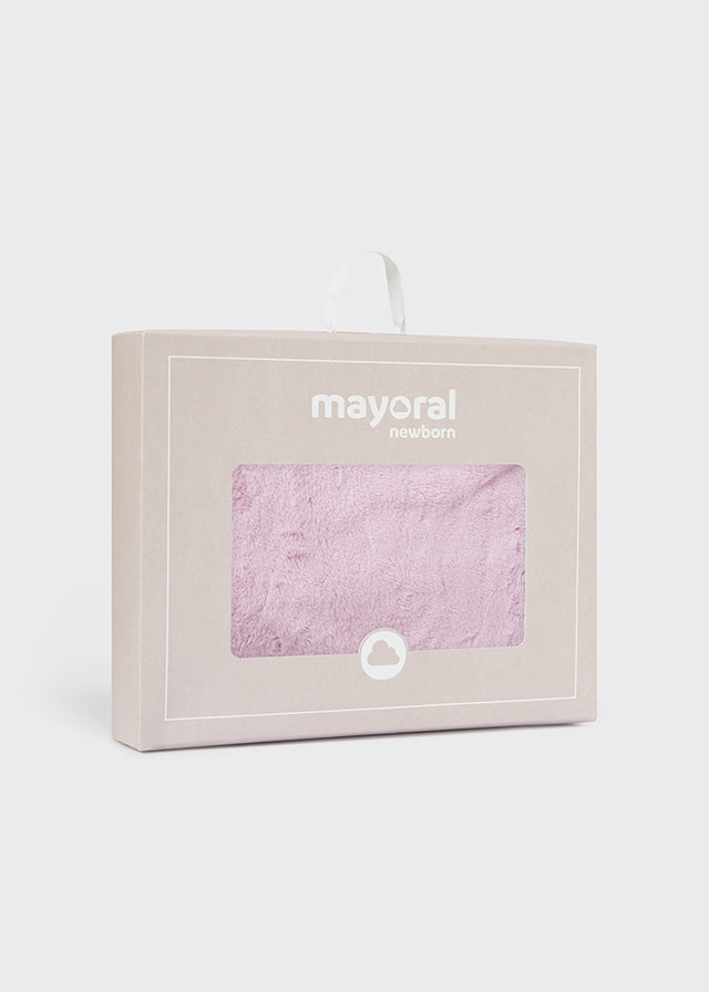 Coperta in pelliccia con pon pon